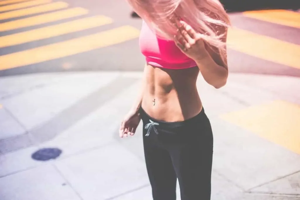 Woman with toned stomach after LA-EMS Body Sculpting Treatment Golders Green